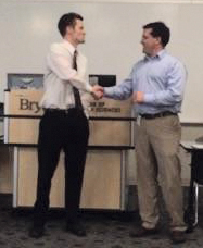 Matt Hilgers accepting the 2015 Nebraska Perfusion Society scholarship from NPS President Jeff Nichols.
