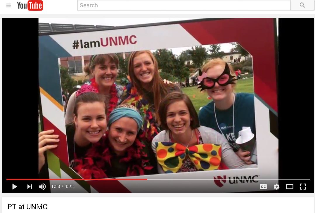 PT students at a fun event with the #IamUNMC frame