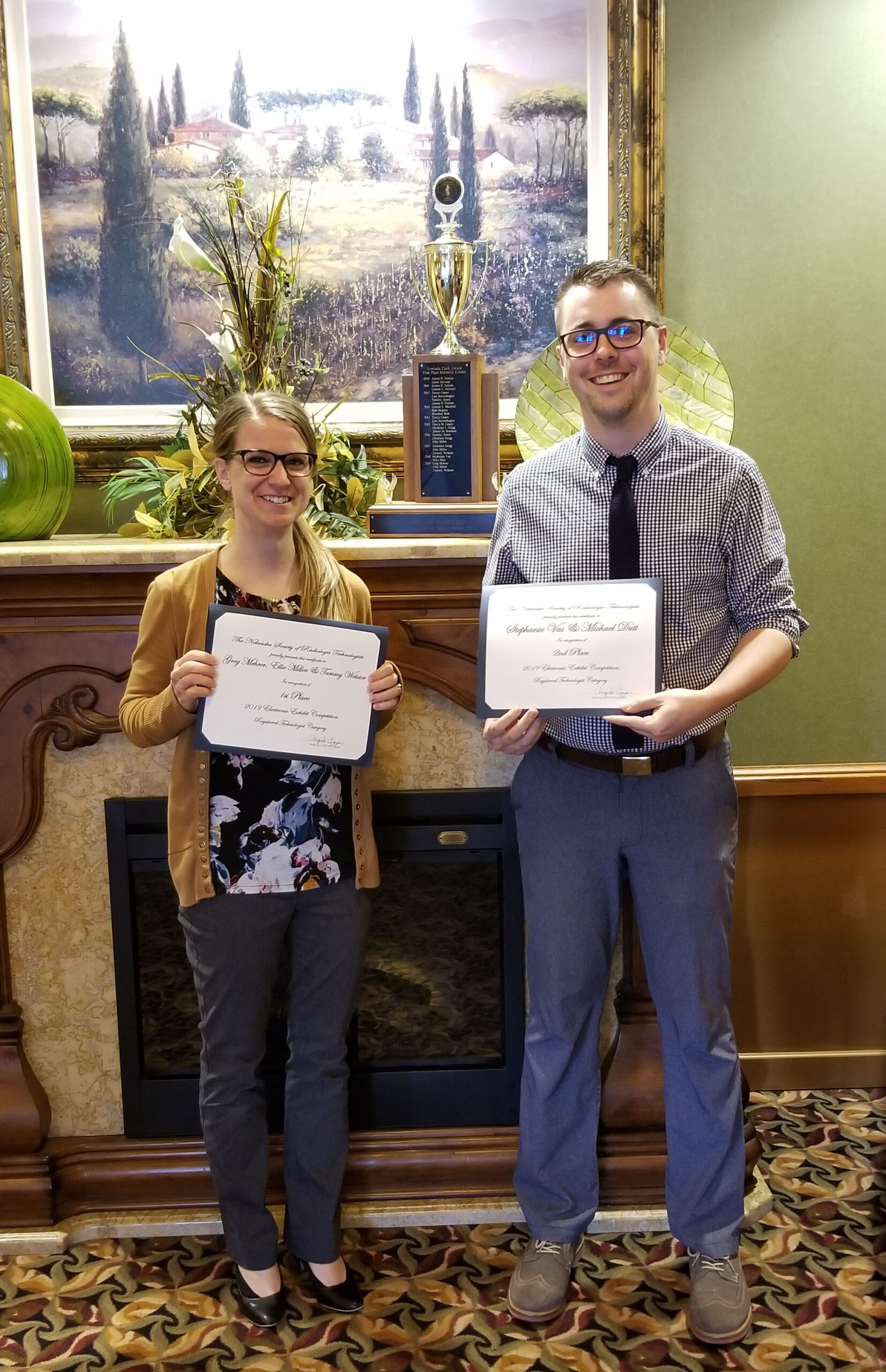 Ellie Miller and Michael Dutt with their certificates