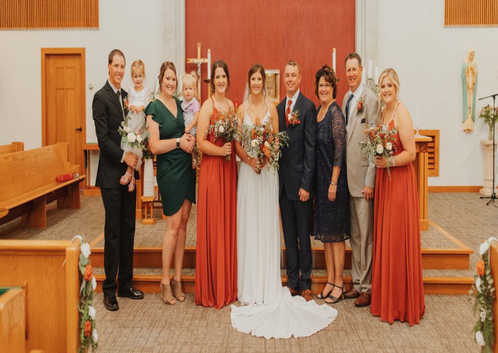 Wedding in a church featuring Rebecca as a bridesmaid