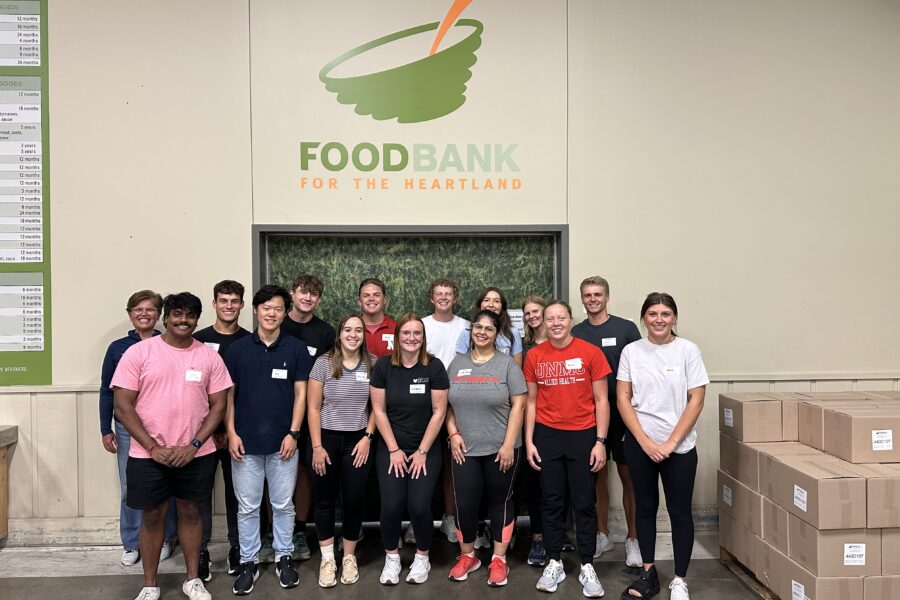 Students pose in front of the Food Bank for the Heartland