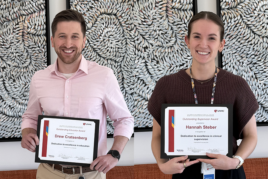 Drew and Hannah pose with award certificates