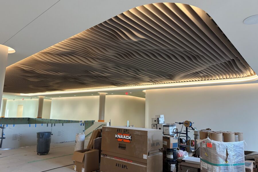 The main staircase features a sculptural ceiling detail&period;