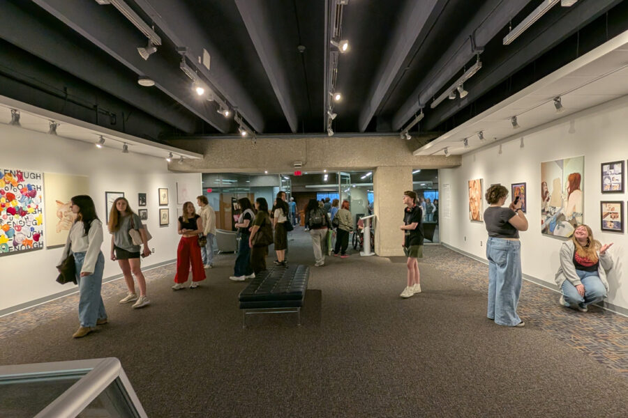 Experiences in Femininity visitors exploring the exhibit