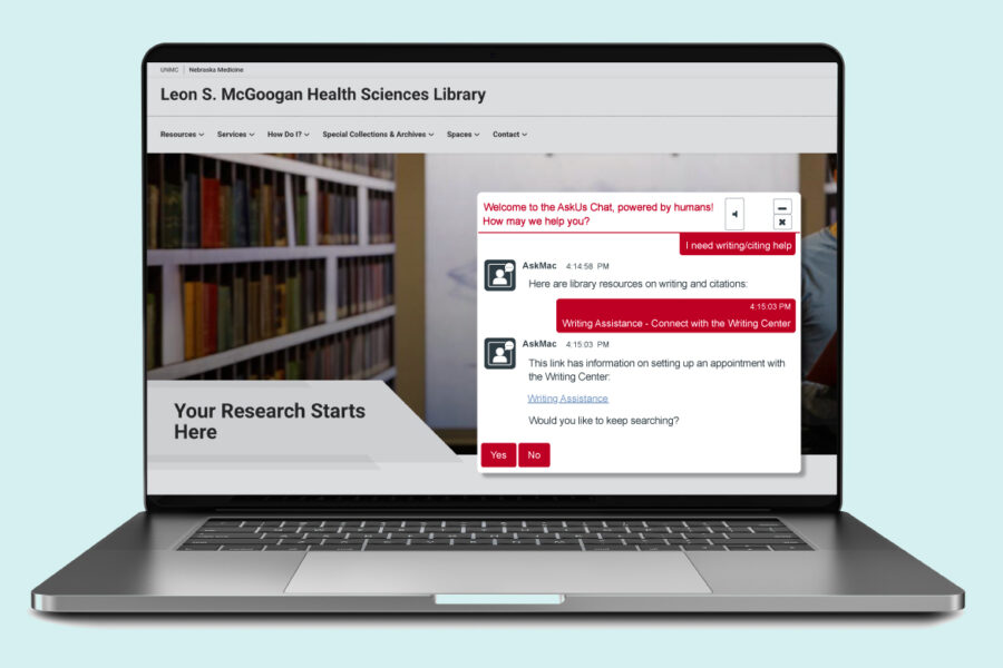 Laptop with AskMac chatbox pop up in use