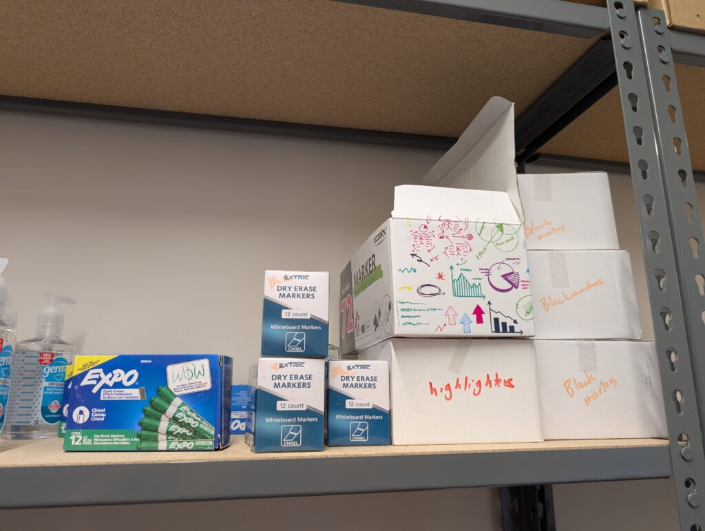 Boxes of dry erase markers on shelf
