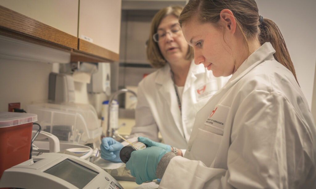Image of faculty provider and student reviewing lab work.