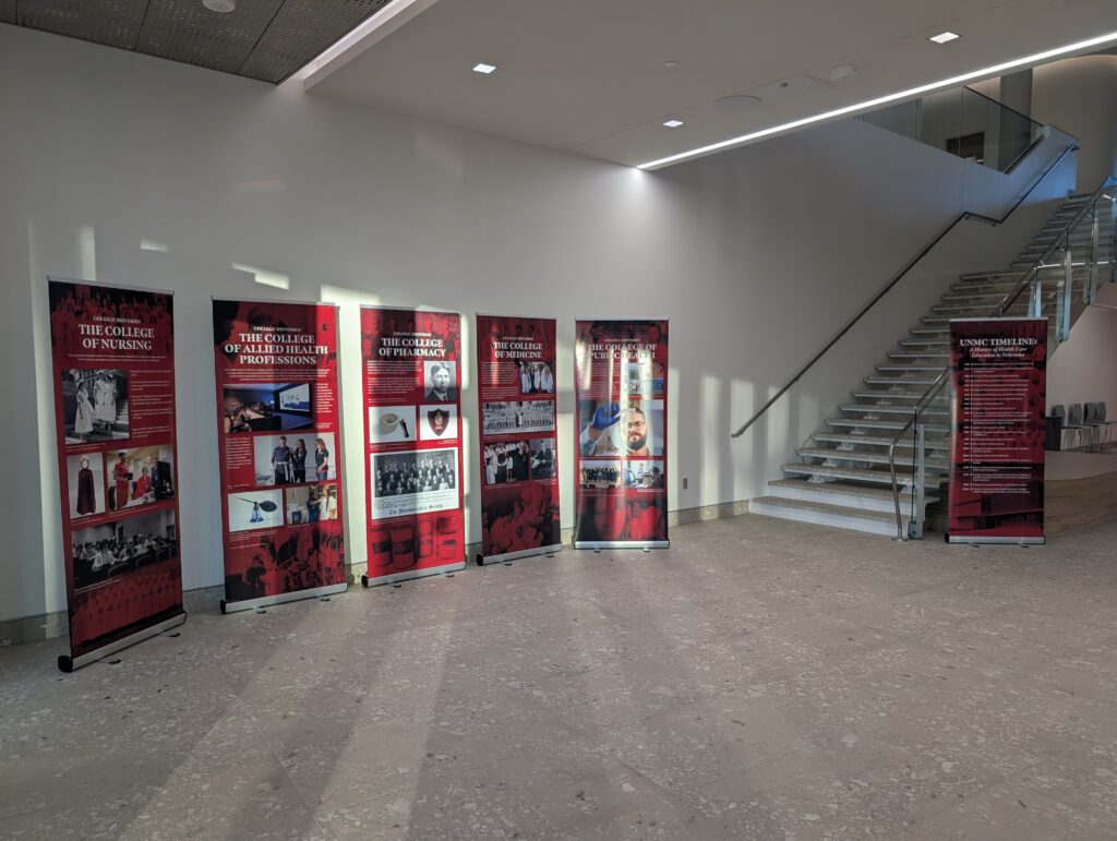 Six pull up banners with texts describing each UNMC College.