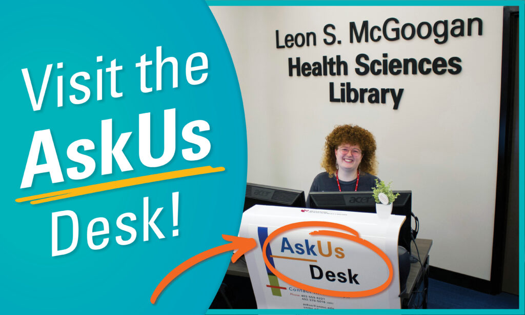 McGoogan Library's Courtney Kilroy sits at the AskUs Desk. White sexton a light blue background reads "Visit the AskUs Desk!" 