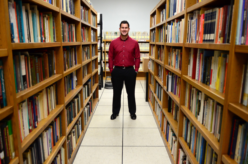 The McGoogan Library's Cameron Boettcher is tasked with unpacking, archiving, organizing, digitizing and otherwise curating the massive collection of Wolf Wolfensberger, Ph.D. (Photos by Rich Watson, UNMC Public Relations)